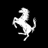 Ferrari logo featuring a white silhouette of a rearing horse with flowing mane